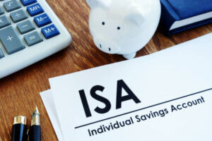 ISA form on a desk with a piggy bank and calculator